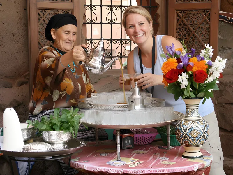 a tourist drinking tea in a Atlas Mountains tour