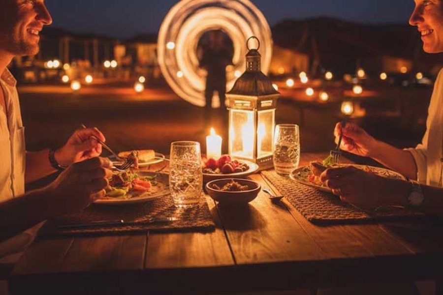 Close-up of a candlelit dinner table set up under the stars in Agafay Desert Marrakech.