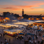 Visitors exploring historic architecture, representing the best things to do in Marrakech.