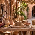 Artisan guiding travelers during a hands-on Marrakech Workshop in a medina pottery atelier