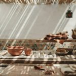 Artisan tools and raw materials laid out on a workbench at a Marrakech Workshop