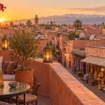 Travelers exploring the lanes of the Marrakech medina during golden hour, a scene reflecting the changing things to do in